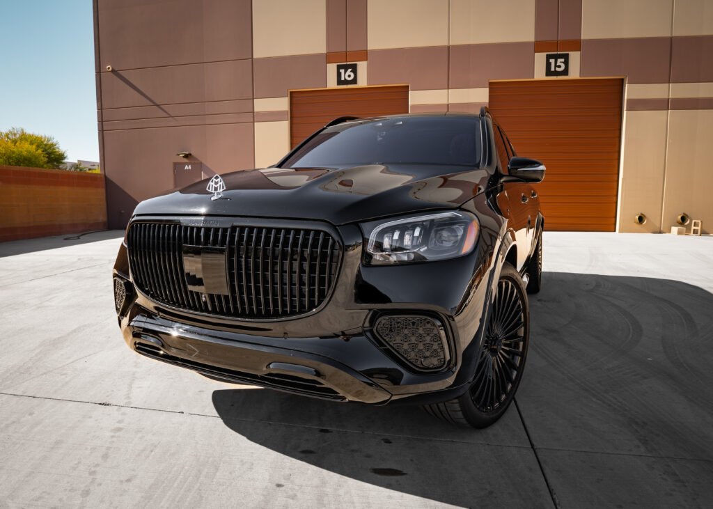 Mercedes-Benz GLS 600 Maybach SUV in sleek black exterior, showcasing luxury design and prominent grille, set against a modern backdrop, available for rent in Scottsdale and Phoenix.