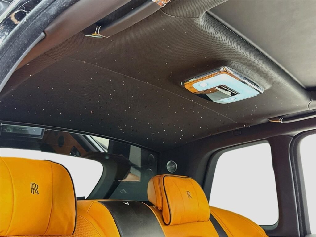 Rolls-Royce Cullinan starlight headliner above saffron leather seats