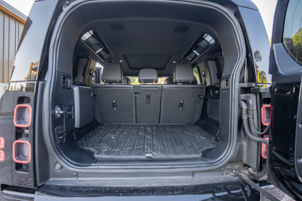 Black Land Rover Defender 110 V8 rental in Scottsdale, rear cargo area view