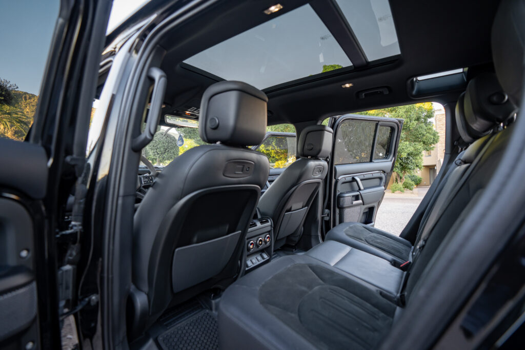 Black Land Rover Defender 110 V8 rental in Scottsdale, rear seats interior view