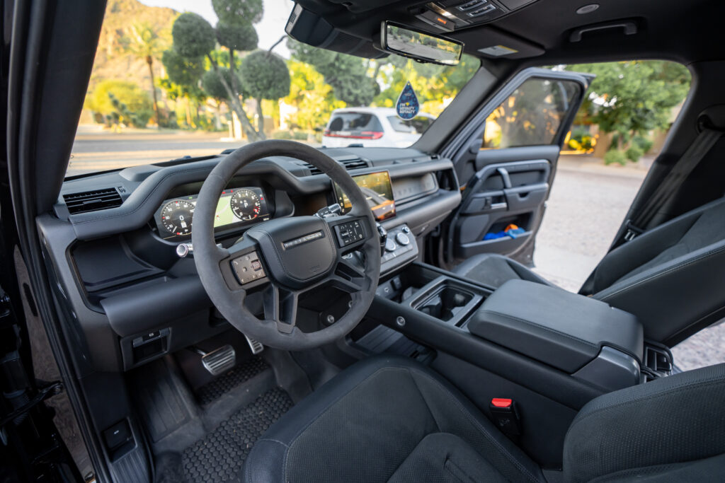 Black Land Rover Defender 110 V8 rental in Scottsdale, dashboard and front interior view