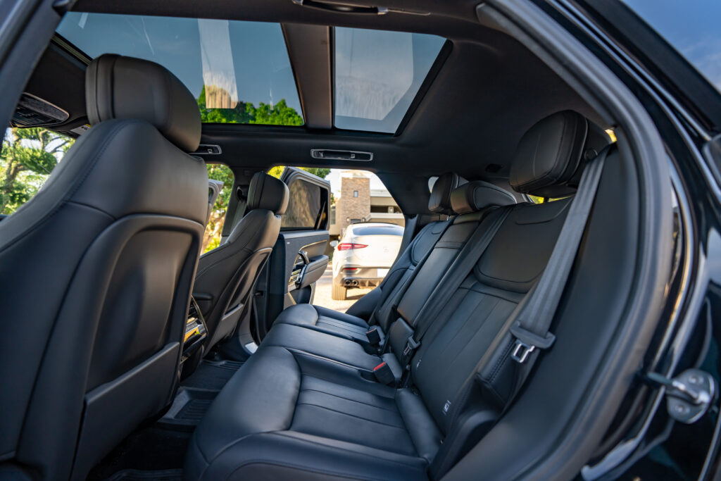 Black 2024 Range Rover Sport rental in Scottsdale, rear seats and panoramic roof interior view