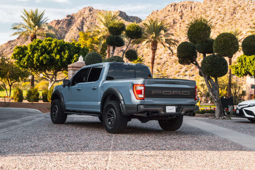 Gray Ford F-150 Raptor rental in Scottsdale, front three-quarter view