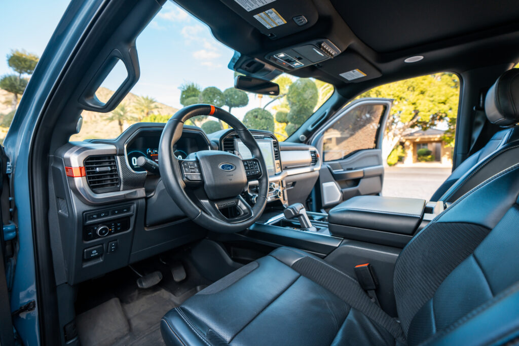Gray Ford F-150 Raptor rental in Scottsdale, dashboard and steering wheel interior view