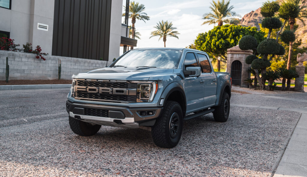 Gray Ford F-150 Raptor rental in Scottsdale, front three-quarter view